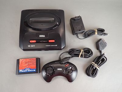 a video game console and a game controller on a table