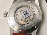 a close up of a wrist watch with a qr code on it
