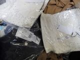two bags of clothing that are wrapped in plastic