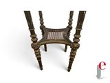 an image of a wooden chair with a cane on it