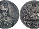 une image représentant une pièce d'argent sur laquelle figure le portrait d'un homme