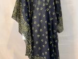 an image of a mannequin mannequin wearing a black and gold dress