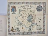 a map on the table with a picture of a town
