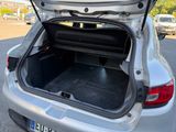 a trunk of a silver car with its trunk open