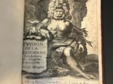 an open book with a drawing of a man holding a sword