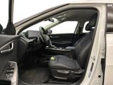 the interior of a car with the door open and the driver ' s seat down