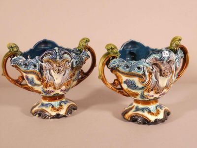 pair of blue and white vases with handles and handles