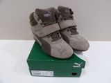 a pair of shoes that are on top of a box
