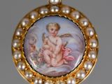 an image of a picture of a baby on a pearl necklace
