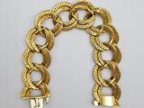 an image of a gold bracelet with a chain link