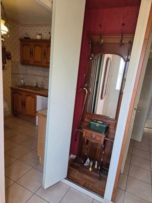 a bathroom with a sink and a mirror in it