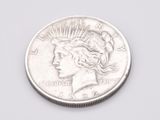 a close up of a coin with a woman ' s head on it