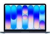 une image représentant un ordinateur portable dont l'écran affiche un motif bleu et violet