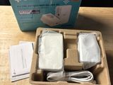 a box with a charger and a charger on a table