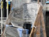a lot of boxes that are wrapped up on a pallet