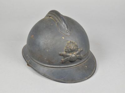 a helmet with a bird on it on a white surface