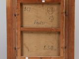 an old wooden easel with a drawing on it and a piece of paper on top of it