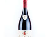 a bottle of wine that is sitting on a table