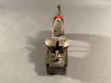 a small toy motorcycle with a man riding on it