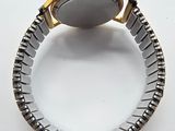 an image of a close up of a wrist watch on a white surface