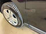 a close up of a tire on the side of a car