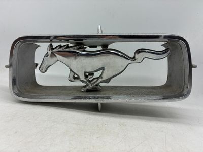 silver plated belt buckle with a running horse on it