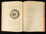 an open book with a picture of a globe on it