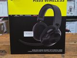 a box with a pair of headphones sitting on top of a wooden table