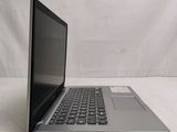 an open laptop computer sitting on top of a white surface