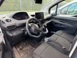 the interior of a small car with a steering wheel and dashboard