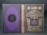 un vieux livre à la couverture violette posé à côté d'un livre violet