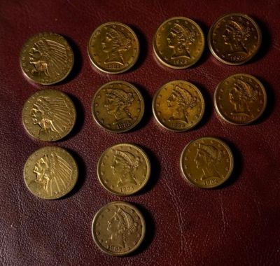 several different types of coins are arranged in a circle on a table