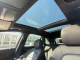 a view of the sunroof from inside of a car