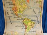map of the world on a table with a blue background