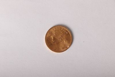 a close up of a penny on a white surface with a white background