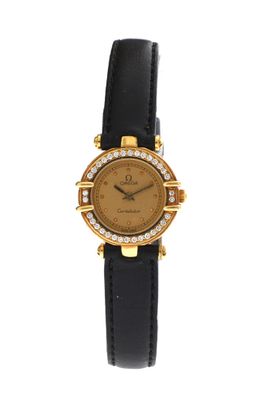 an image of a gold plated wrist watch with black leather strap