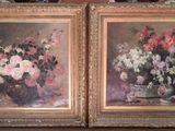 two paintings of flowers in vases on a table in front of a mirror