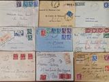 many different types of letters and envelopes on the table