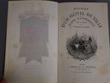 someone is holding an open book with a picture of a castle on it