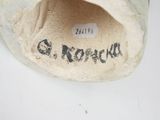 a close up of a shoe with a tag on it
