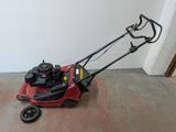 an image of a lawn mower in a garage