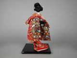 an image of a doll of a woman wearing a kimono