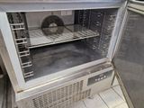 an open oven with a fan inside of it