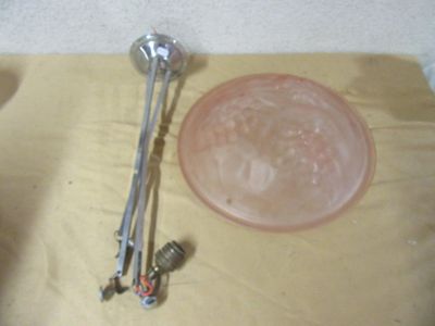 a bowl and a spoon sitting on a table next to a glass