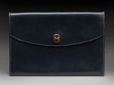an image of a black leather wallet with a gold clasp