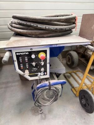 a cart with a bunch of hoses on top of it