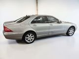 a silver car that is parked in a garage
