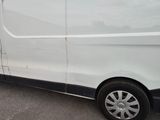 a white van that is parked in a parking lot