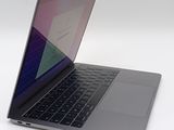 a close up of a laptop computer on a white surface
