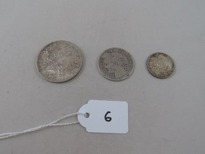 several coins and a price tag sitting on a table
